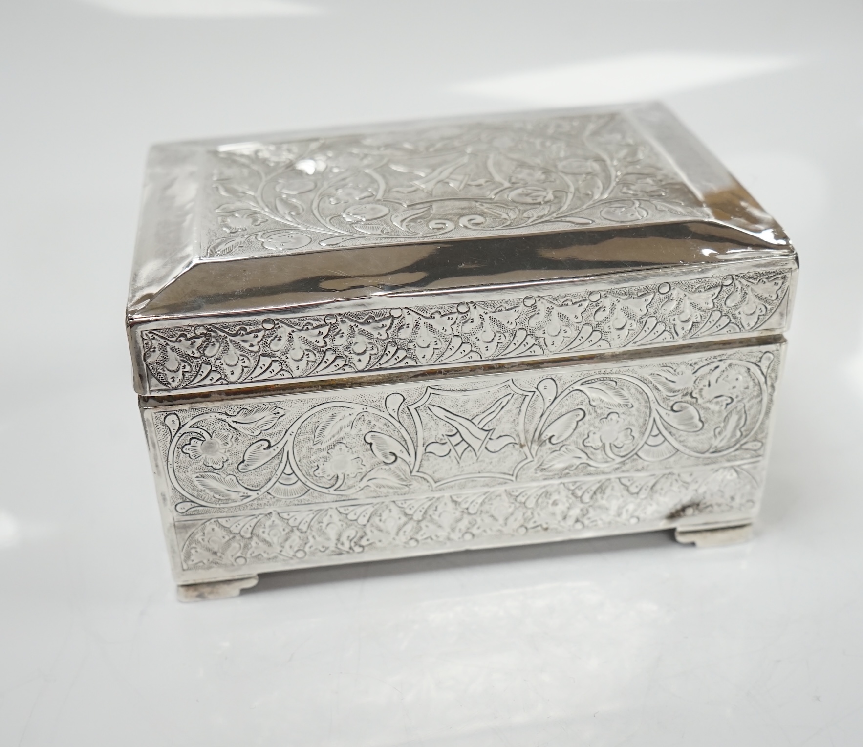 Two silver cigarette cases, a silver plated cigarette case and a Thai? white metal cigarette box, 11.6cm. Condition - poor to fair